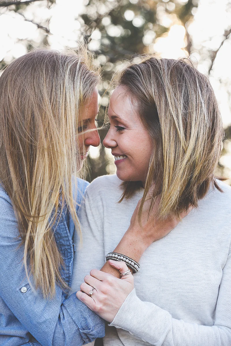 mt. airy north carolina natural engagement ashley and ruthie smiling at one another