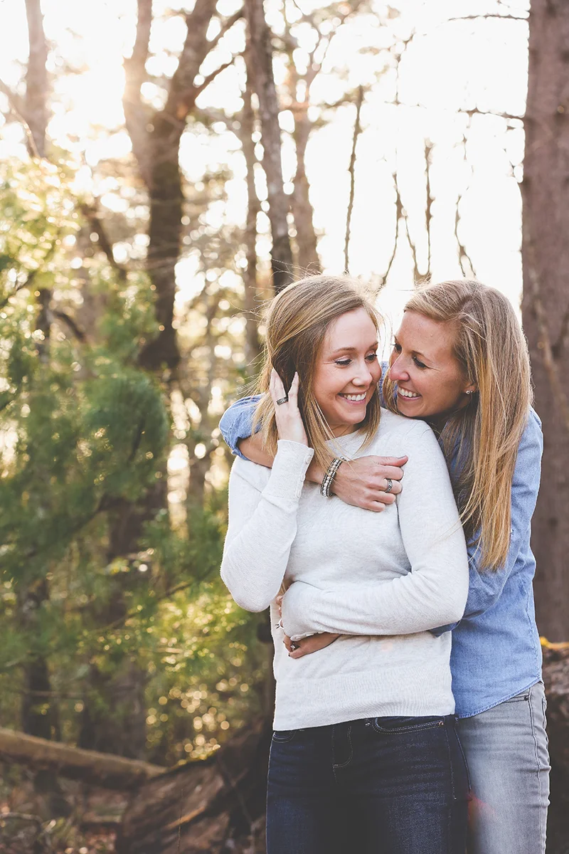 mt. airy north carolina natural engagement ashley and ruthie embrace in woods
