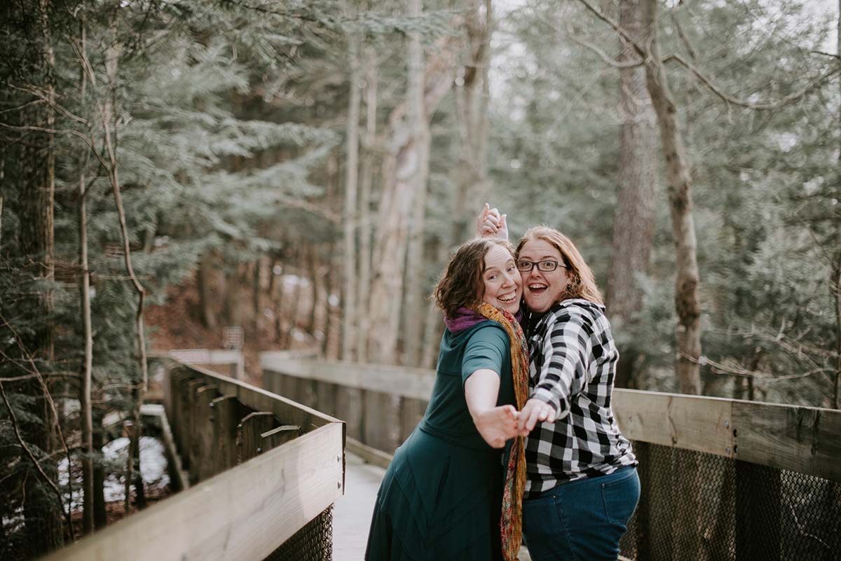 Emily and Ang Beach Wedding Engagement Session at Hoffmaster State Park on Lake Michigan by Liv Lyzsyk Photography