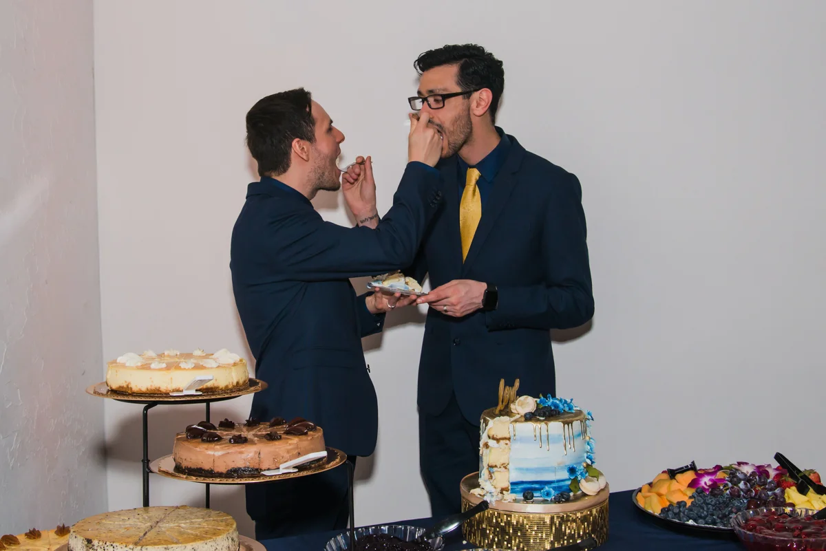 rialto theatre wedding couple feeding each other cake
