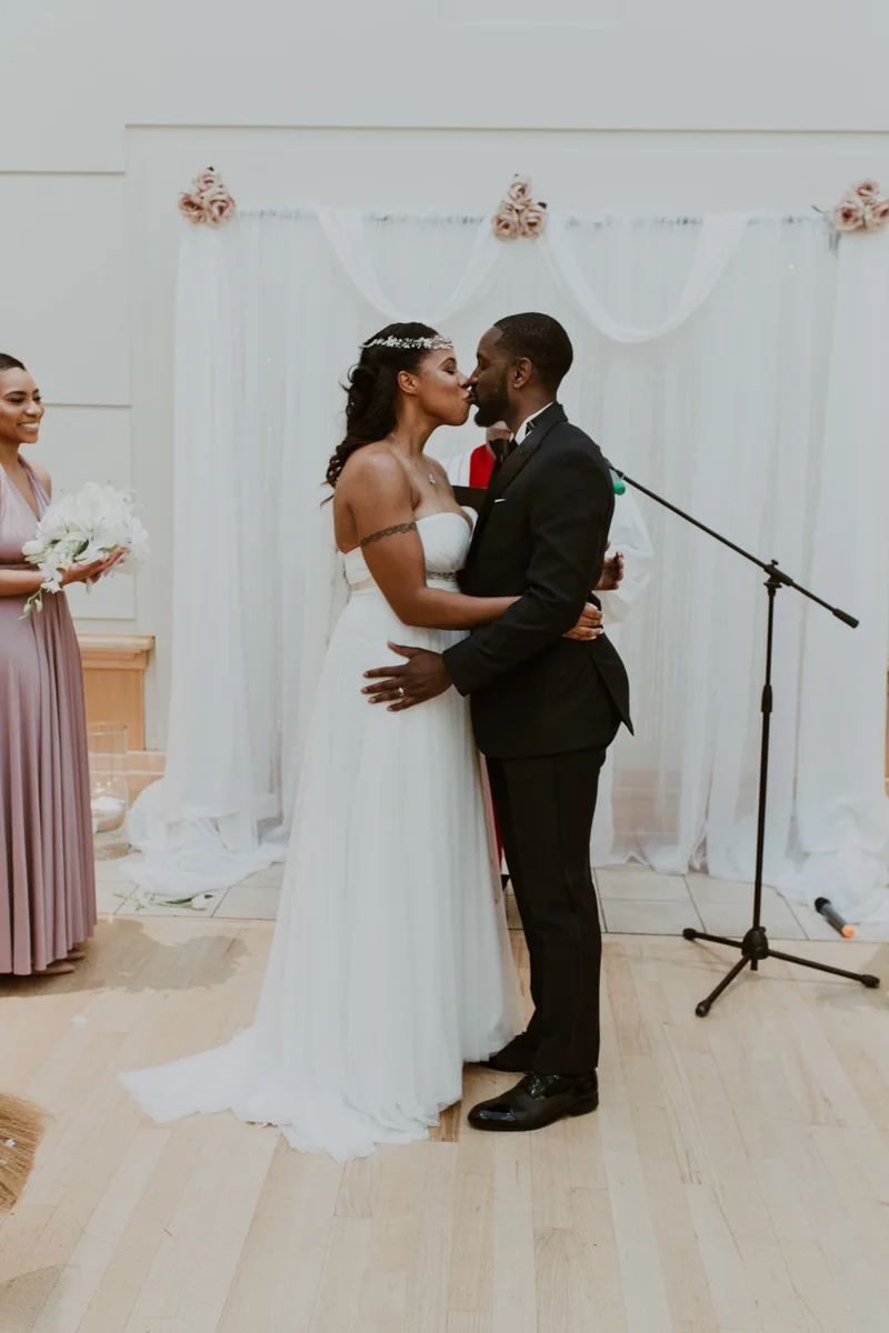art-inspired levine museum wedding ceremony kiss