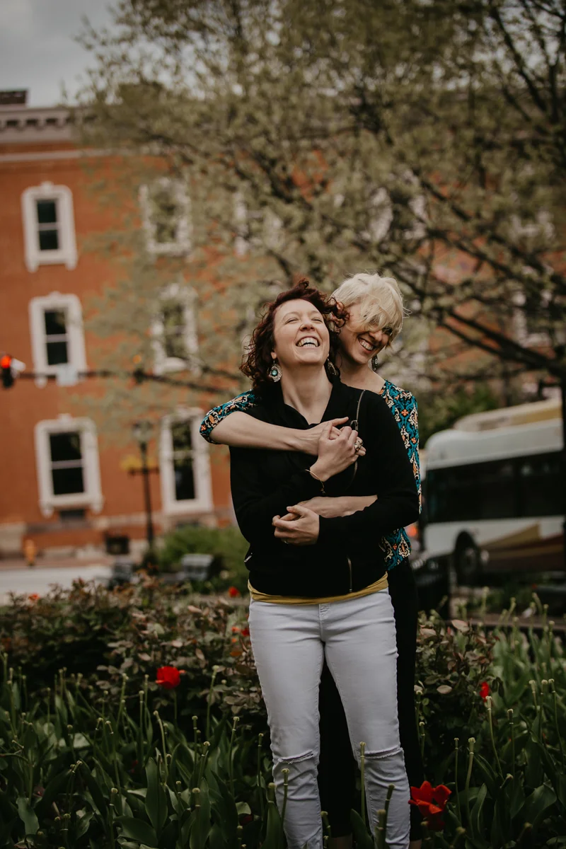 BALTIMORE COFFEE SHOP ENGAGEMENT SESSION EMBRACE IN GARDEN