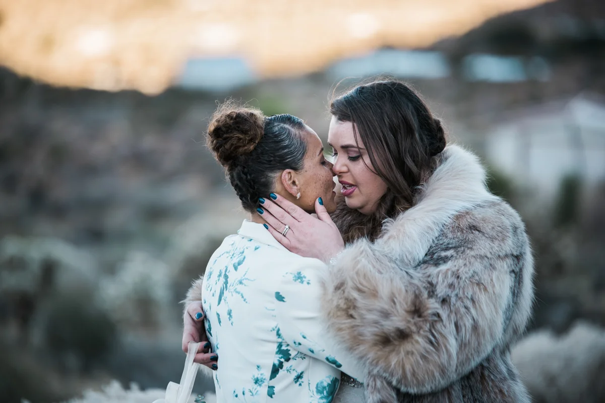 multi-cultural desert elopement just before kiss
