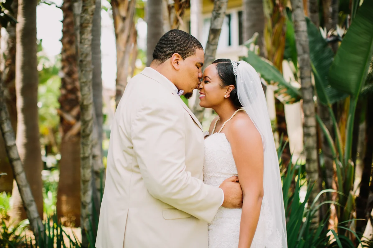 San Diego Tropical-Inspired Wedding william kissing janelle's nose