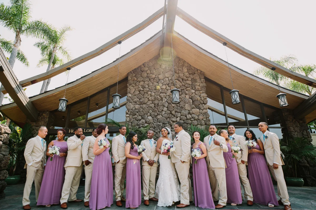 San Diego Tropical-Inspired Wedding candid of wedding party getting ready for photo outside venue