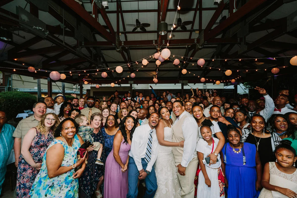 San Diego Tropical-Inspired Wedding group picture of all wedding guests with bride and groom in middle