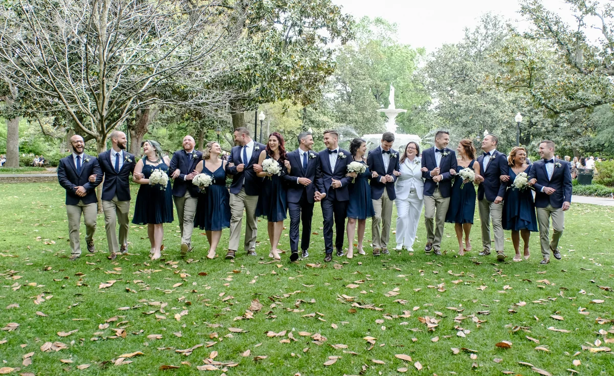 Classic southern style wedding savannah georgia wedding party in garden, arms linked, candid