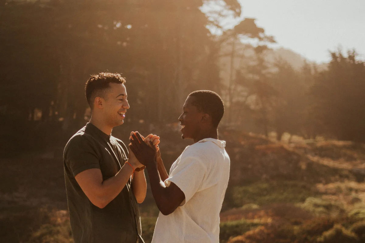 couples session baker beach san francisco california candid of caleb and eugene holding hands