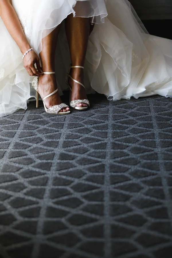 african american, christian, and muslim traditions minneapolis wedding Taara fastening glittery wedding heels
