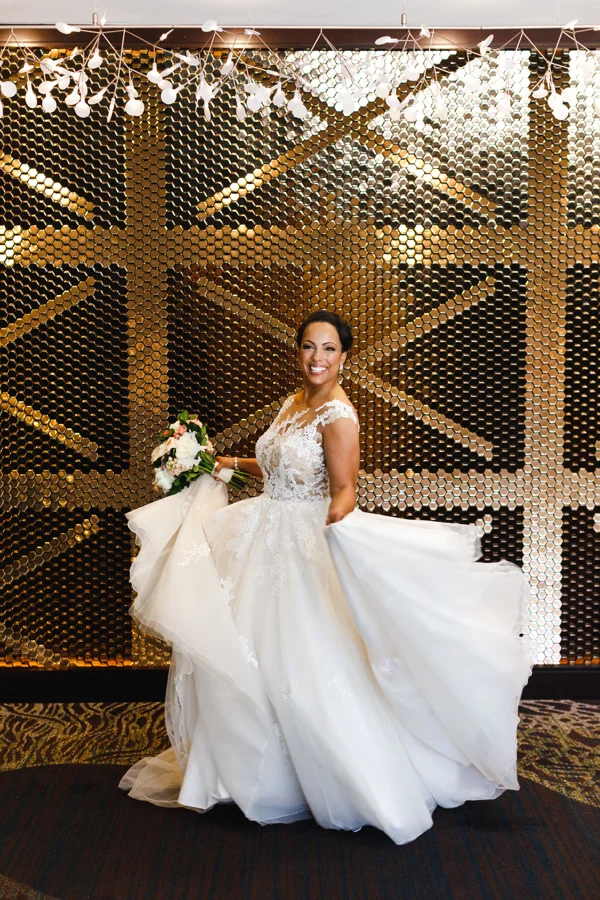 african american, christian, and muslim traditions minneapolis wedding taara twirling in wedding dress