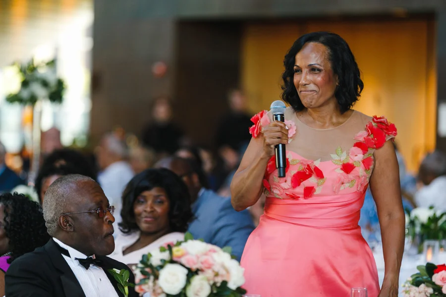 african american, christian, and muslim traditions minneapolis wedding mother giving speech at reception