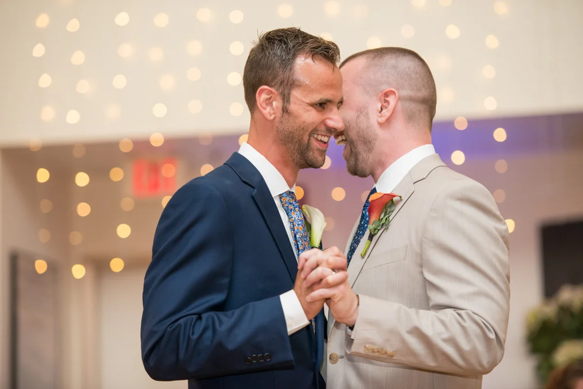 LGBTQ newlywed couple dancing at their wedding reception Leise Jones Photography Boston MA
