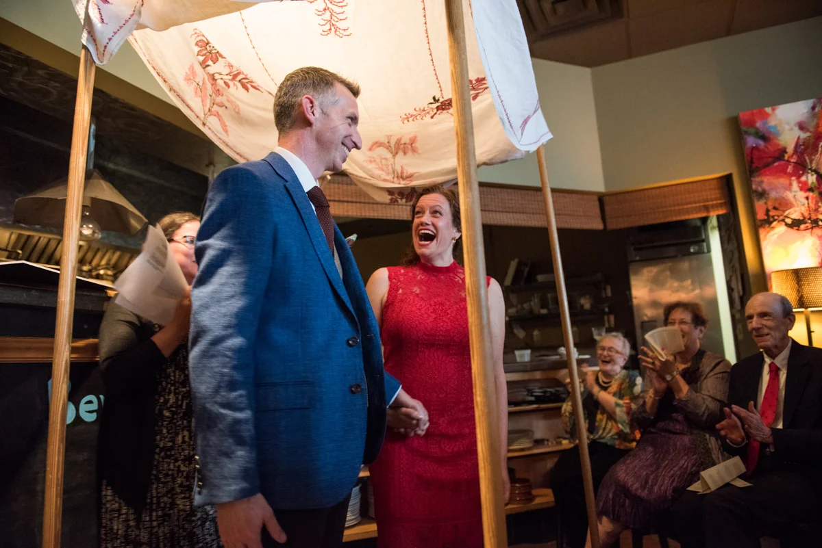 Bride and groom getting married under a chuppah Leise Jones Photography Boston MA