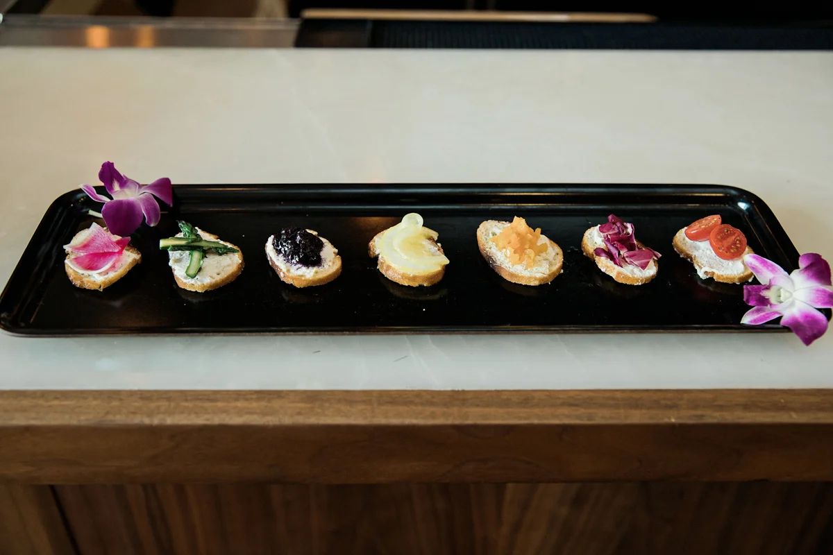80s themed pride party brooklyn new york tray of hors d’oeurves with pride flag-themed toppings