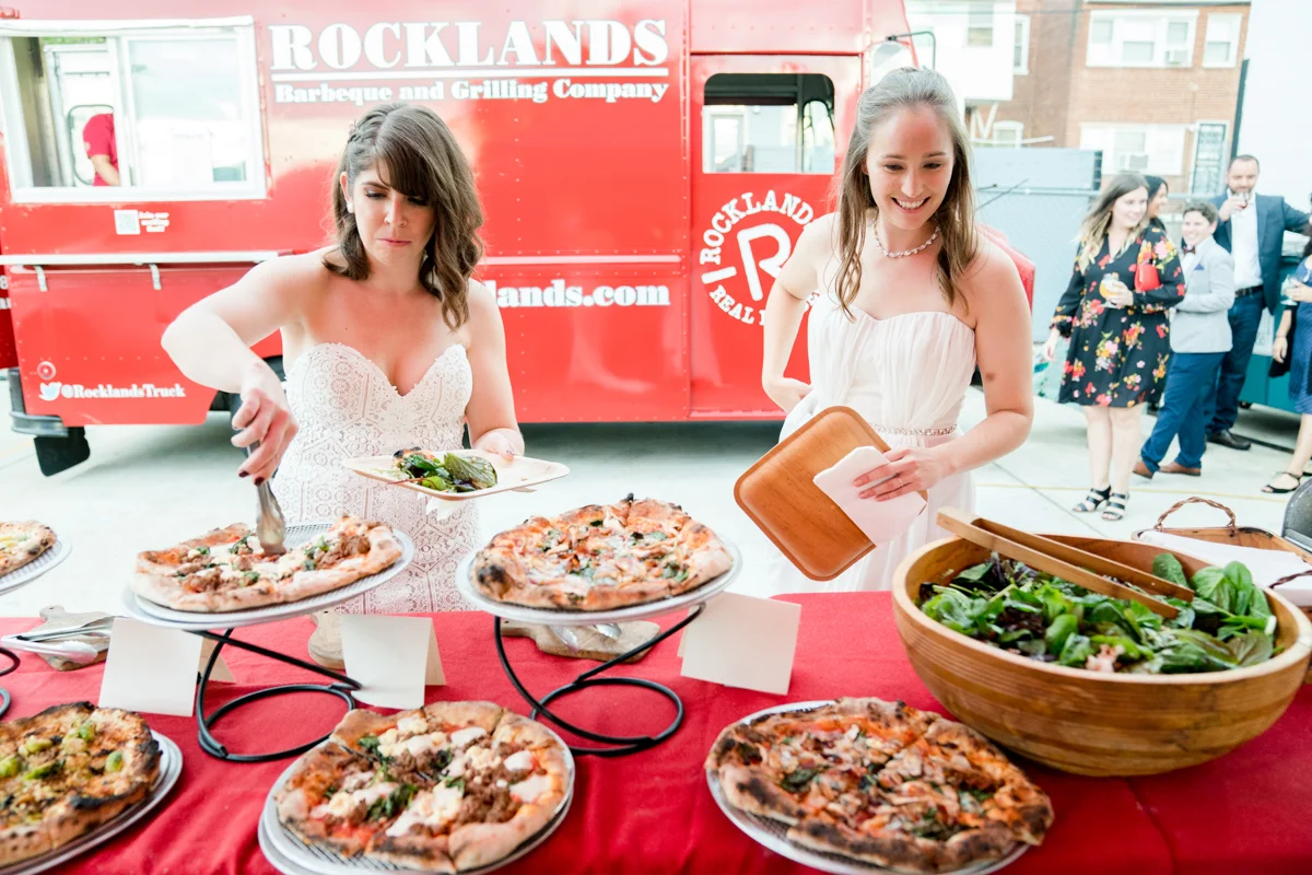 Brewery wedding washington D.C. maggie and whitney getting salad and pizza