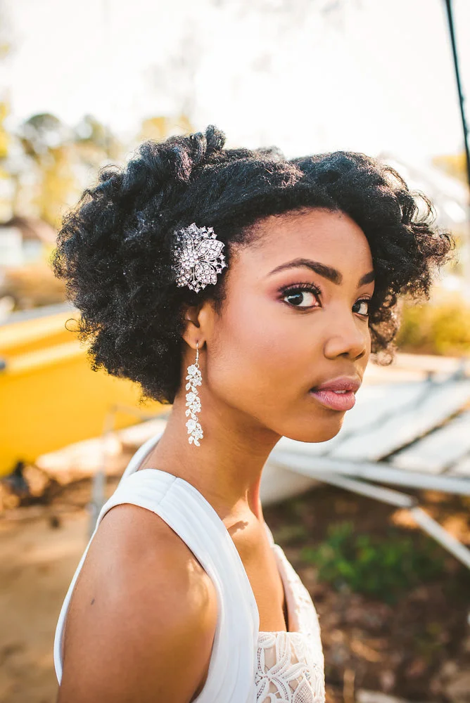 wedding inspiration the boathouse at sunday park midlothian virginia bride with jewel hair clip and dangling floral earrings