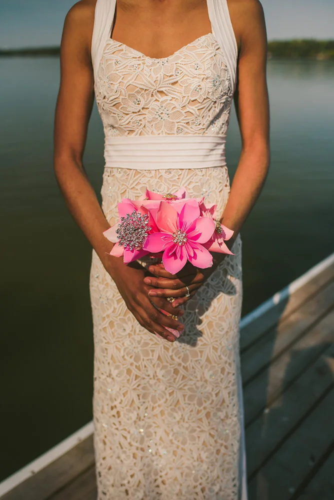 wedding inspiration the boathouse at sunday park midlothian virginia bride holding jewel-and-paper bouquet on dock