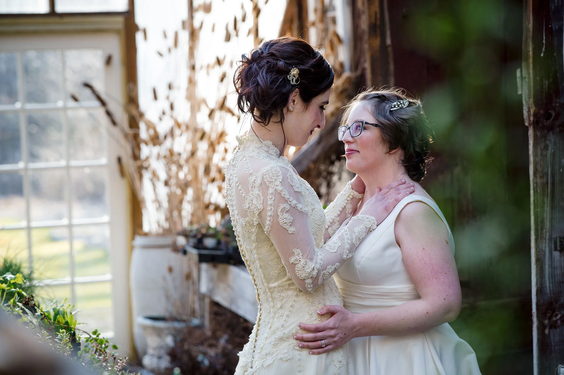 two brides embracing for portraits after wedding michelle schapiro photography