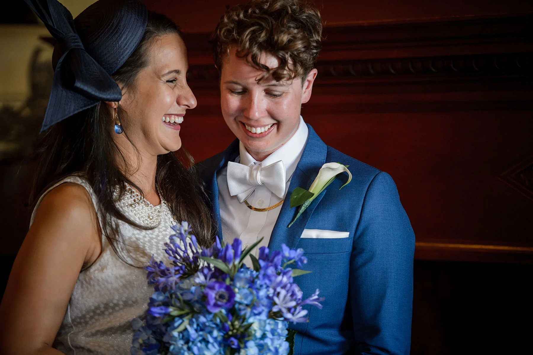 newlywed couple laughing and smiling after their wedding