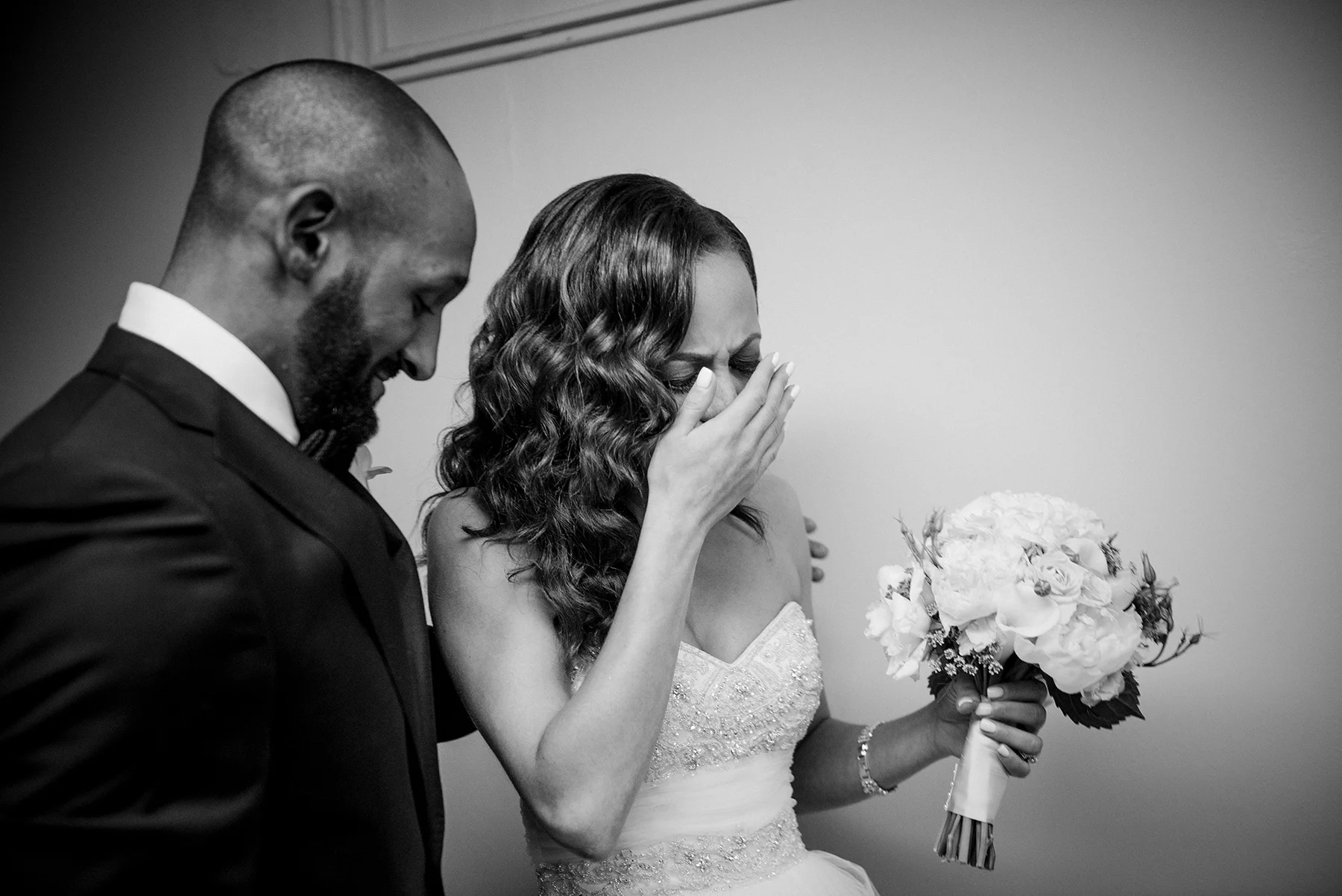 bride crying tears of joy with groom during first look michelle schapiro photography
