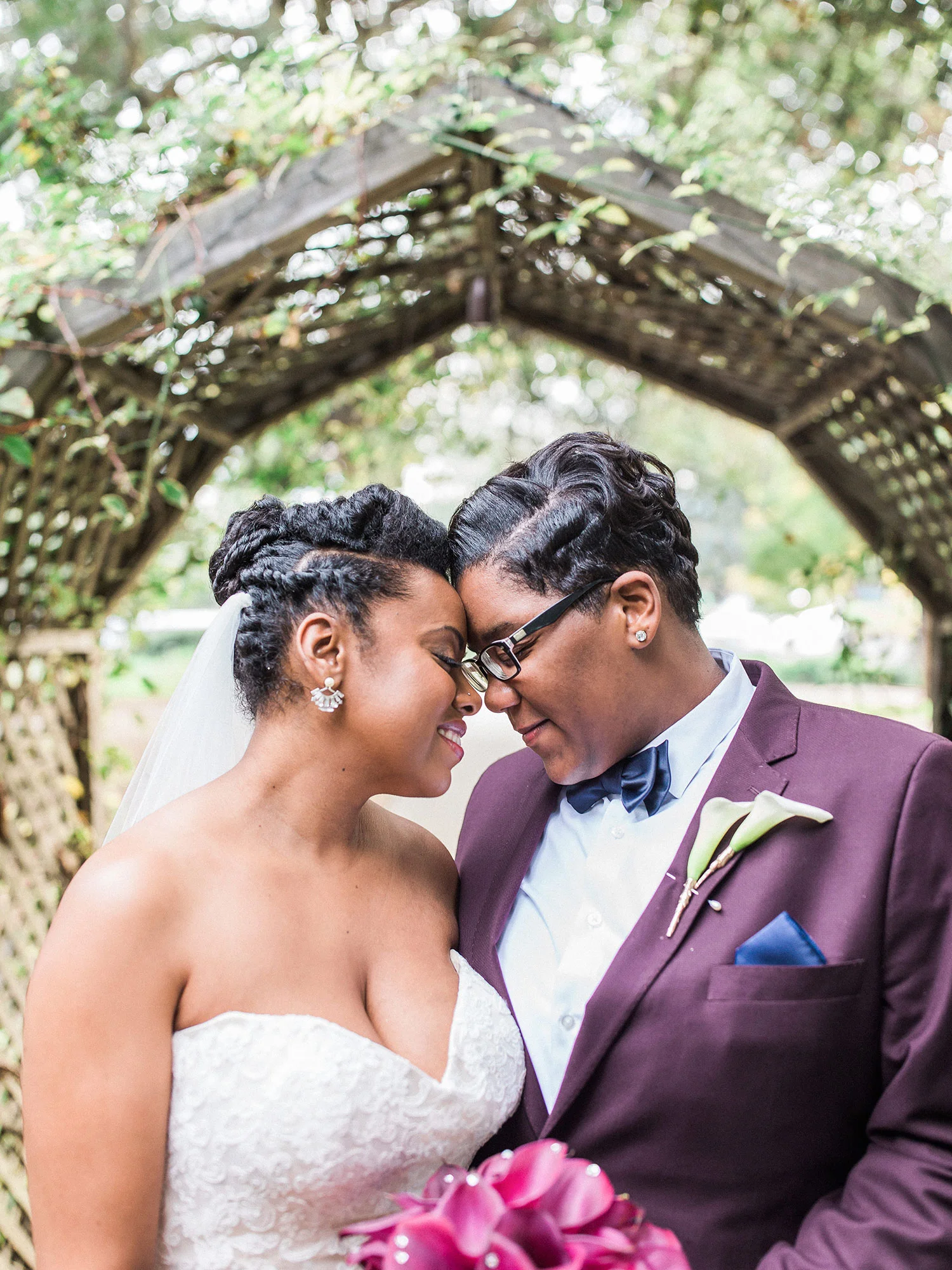 Newlywed couple smiling and touching foreheads together under tree Apollo Fotografie San Francisco California