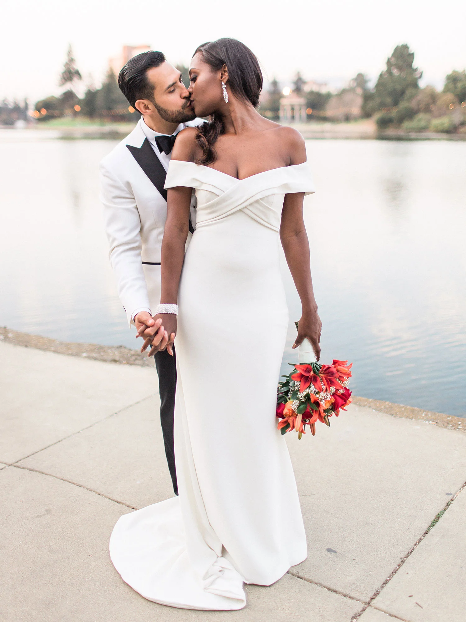 bride and groom about to kiss on walkway along water front Apollo Fotografie San Francisco
