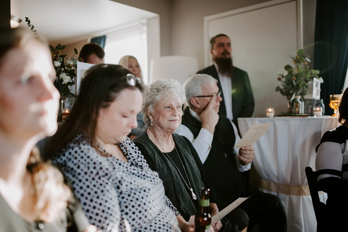 queer surprise home wedding guests at ceremony