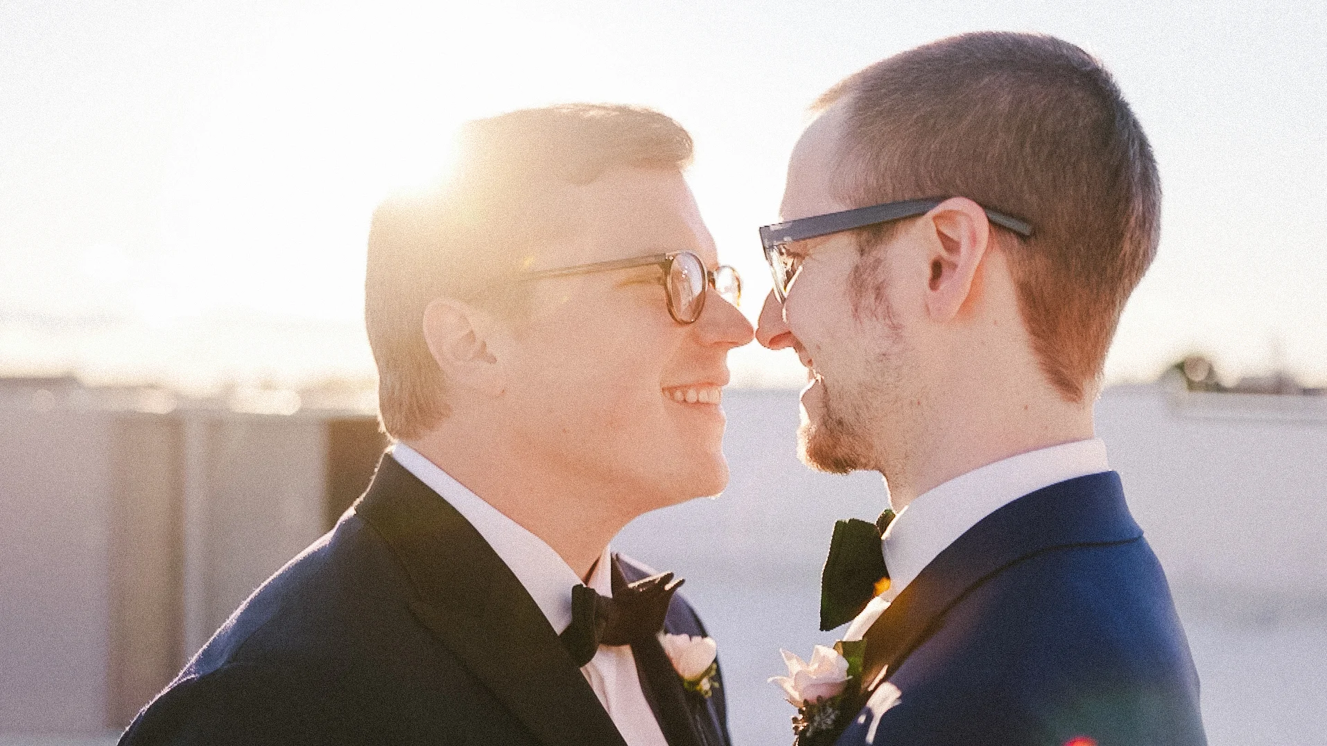 Two grooms touch noses at wedding Philadelphia PA Love More Films