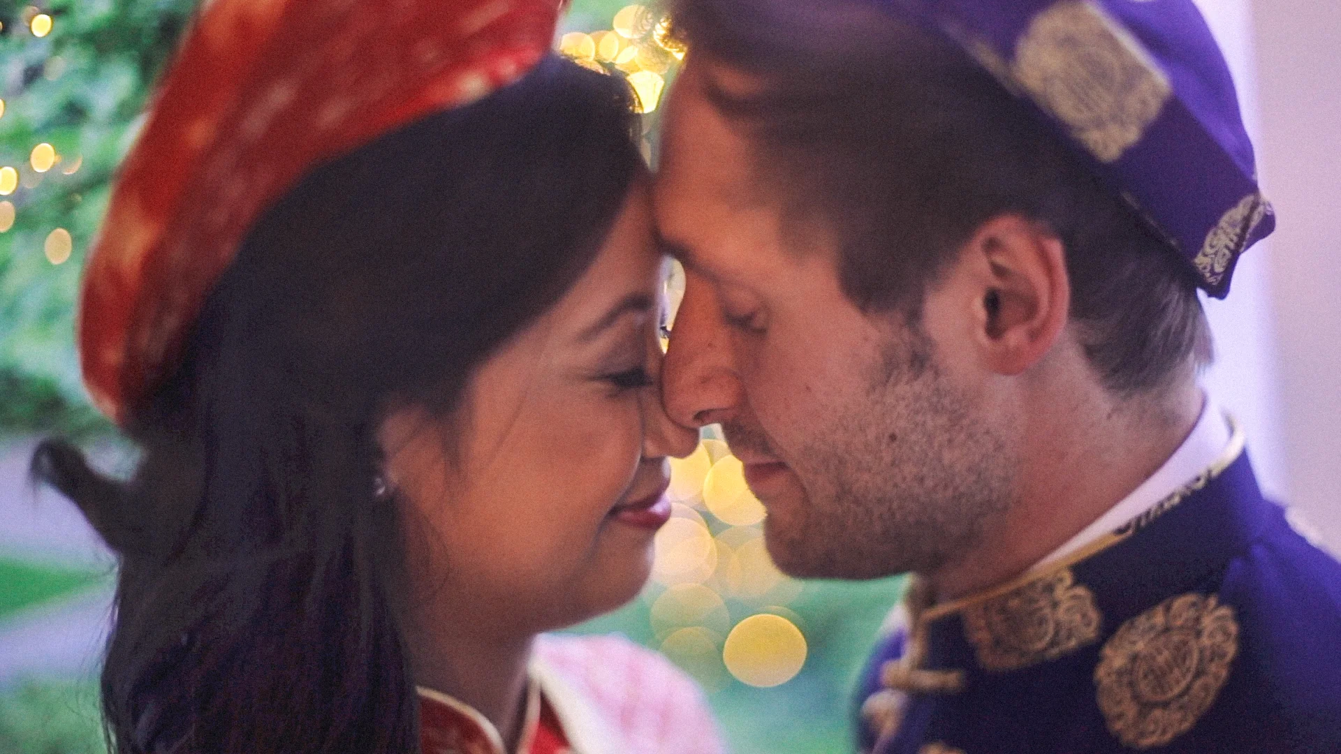 Multicultural newlyweds touching noses at wedding Lancaster Pensylvania Love More Films