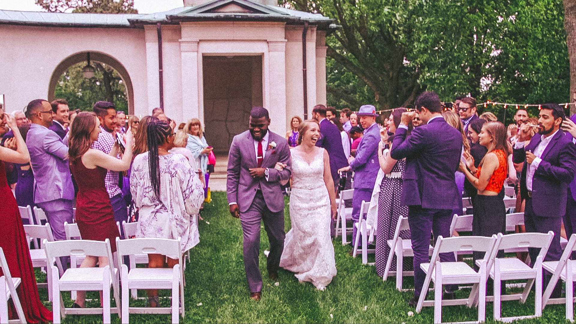 Couple just married walking back up the aisle Philadelphia PA Love More Films