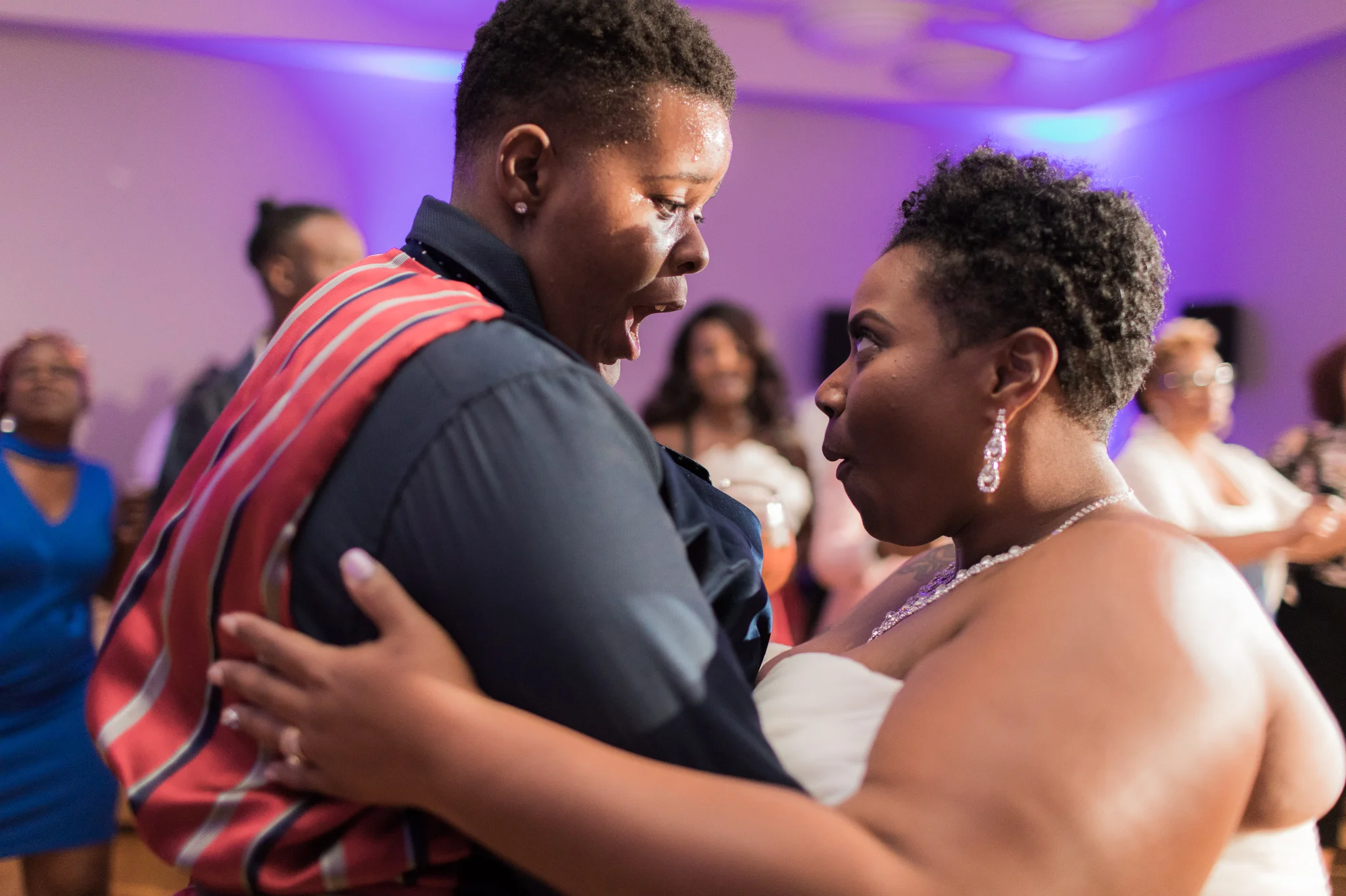 black newlywed couple dancing and laughing on the dance floor at their wedding reception Meera Graham Photography Missoula Montana