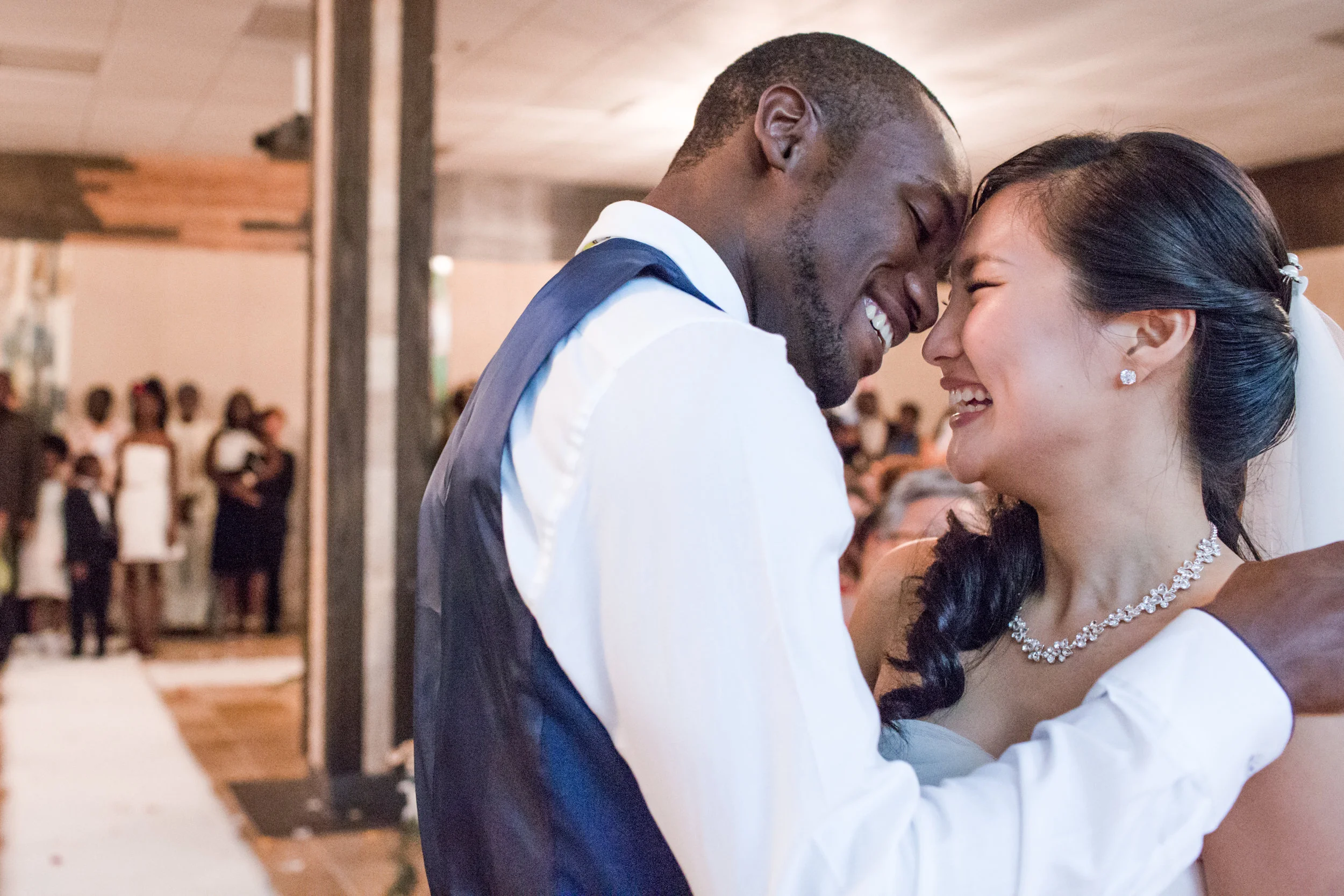 bride and groom embracing and about to kiss on the dance floor at their wedding reception Meera Graham Photography Missoula Montana