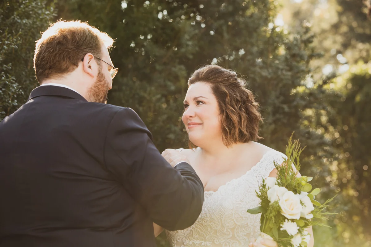 Romantic, Intimate-Feeling Wedding first look in garden with dreamy sunset light