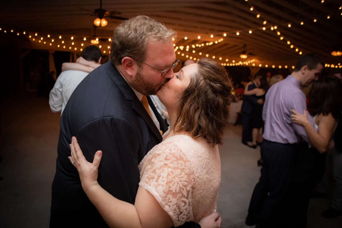 Romantic, Intimate-Feeling Wedding caroline and jon kiss on dance floor