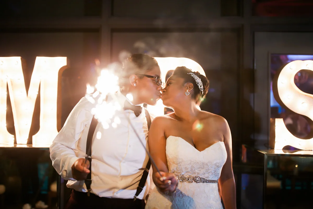 los altos lutheran same-sex wedding kiss while holding sparklers
