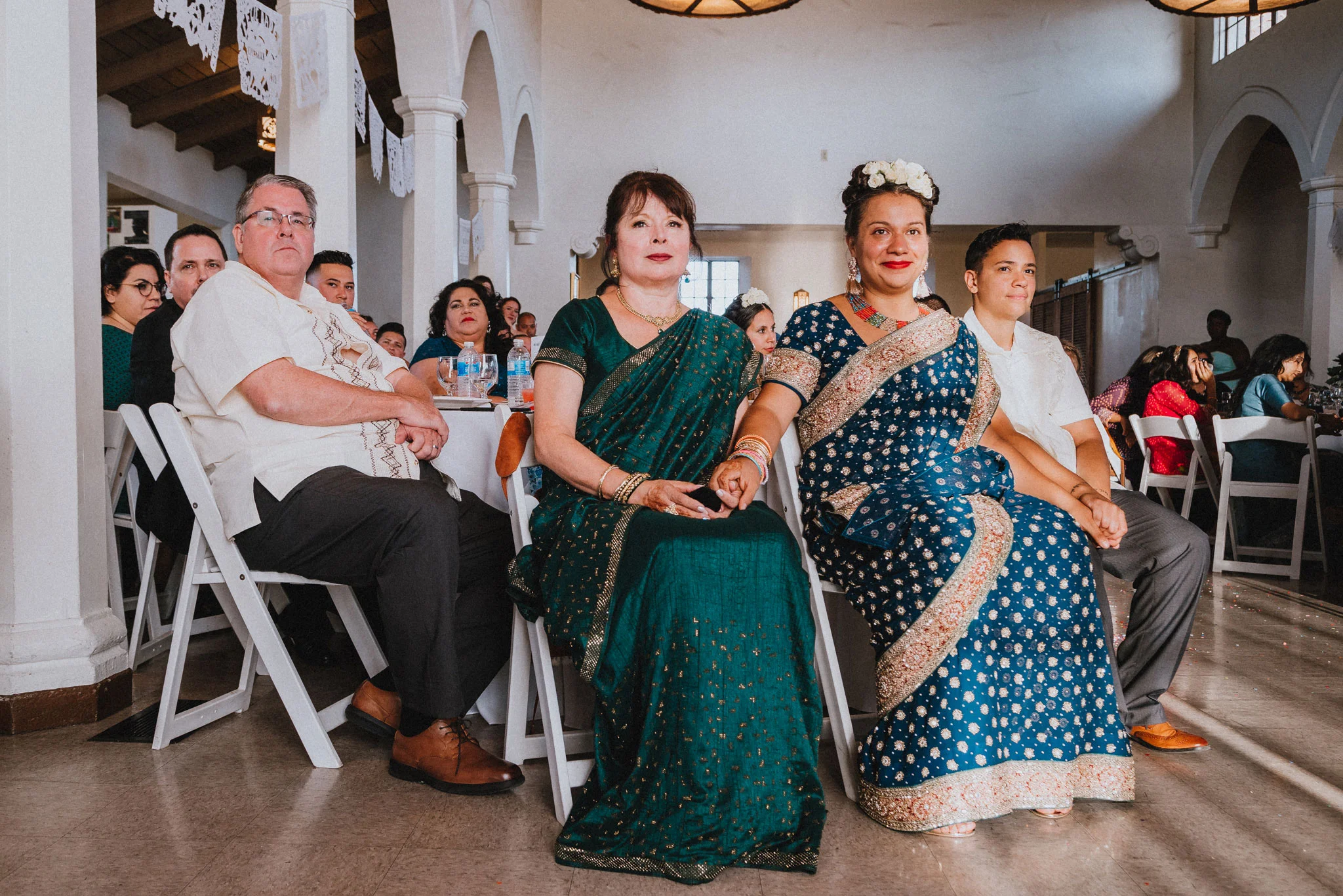 guests and family looking on at wedding reception by los angeles wedding photographer Rebecca y Las Otras