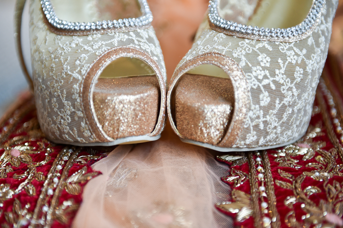 Mita’s lace open toe pumps on top of her sari for their Indian wedding ceremony in Hong Kong