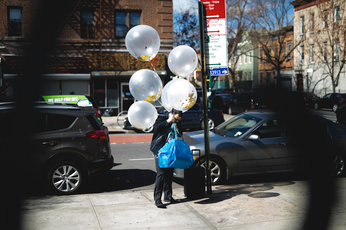 My husband bringing the giant confetti balloons I insisted on having. He’s the best.