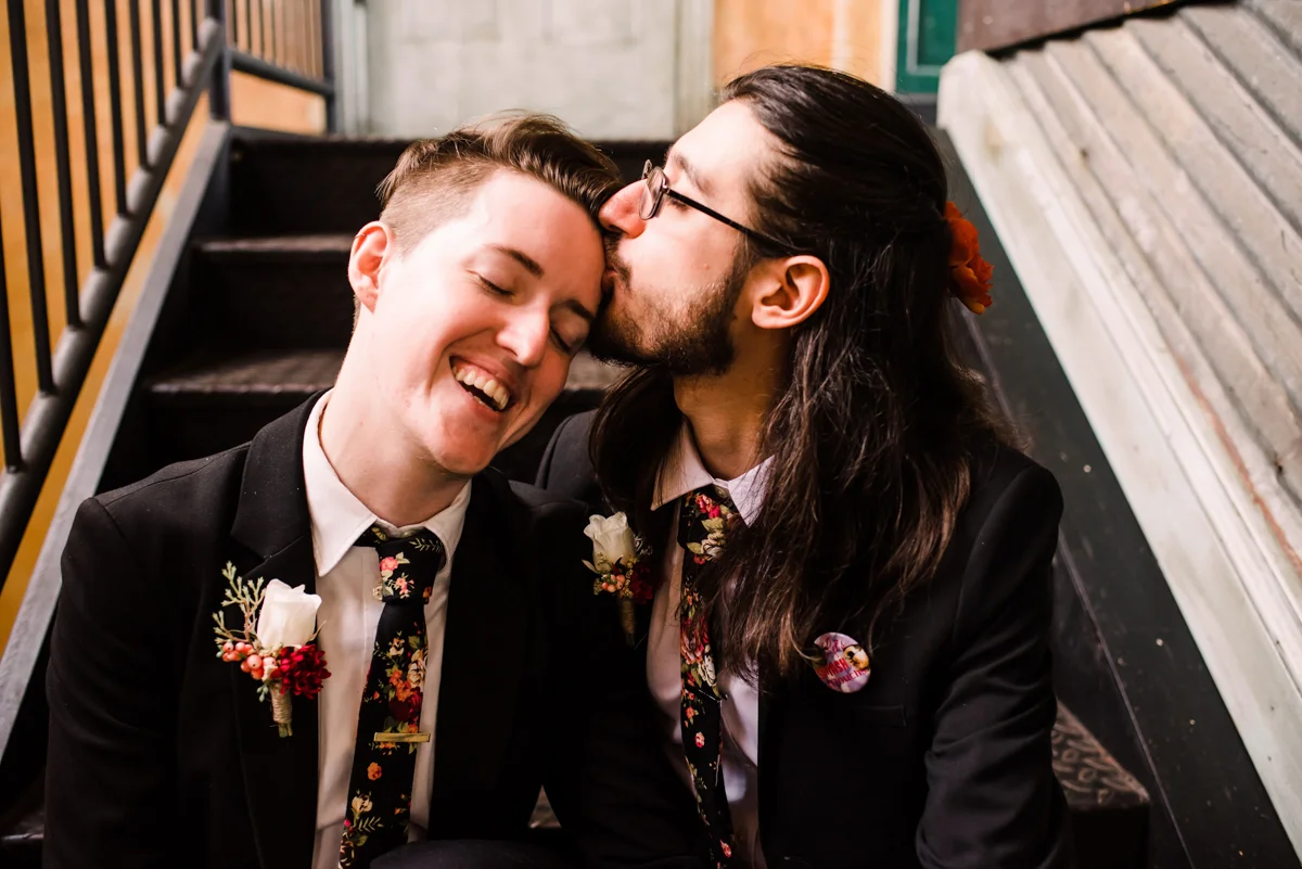 intimate wedding richmond virginia couple sitting on stairs, stephan kissing erin’s forehead