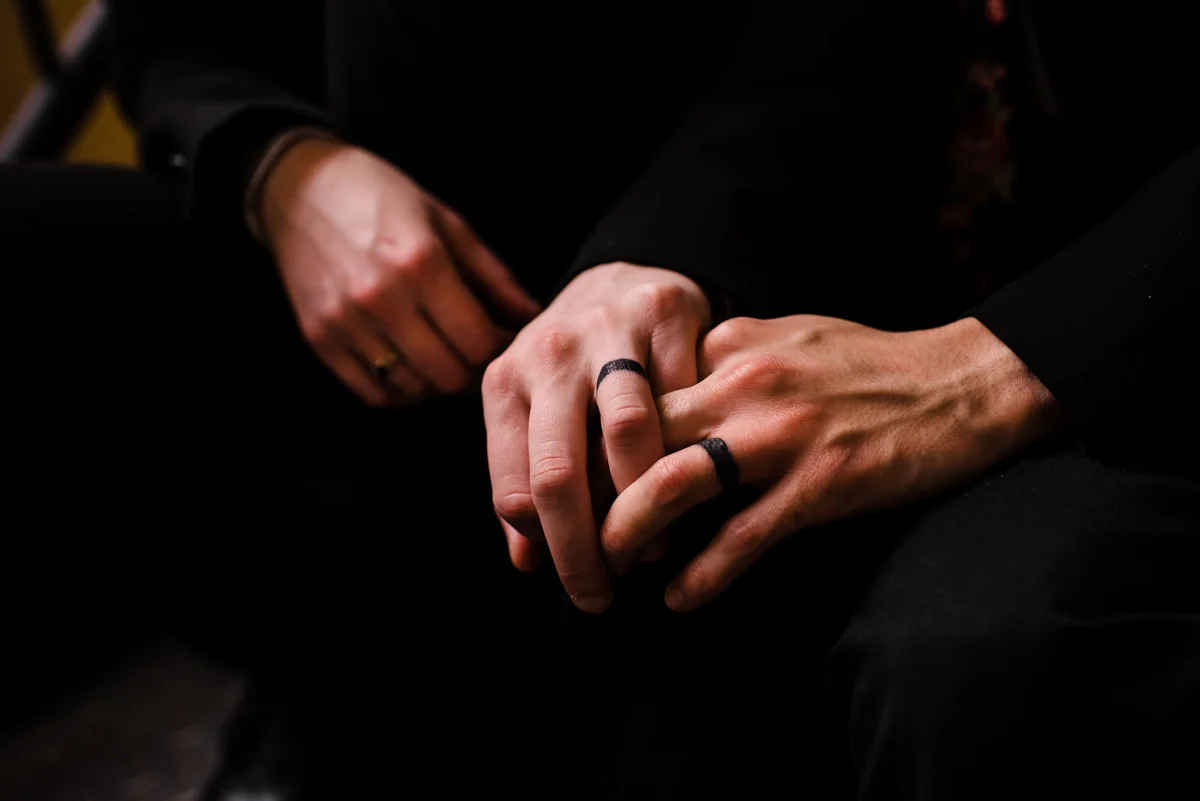 intimate wedding richmond virginia erin and stephan holding hands with tattooed rings