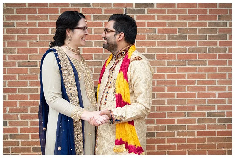 Newlywed couple holds hands after their multicultural wedding Sharma Shari Miami Wedding Photographer