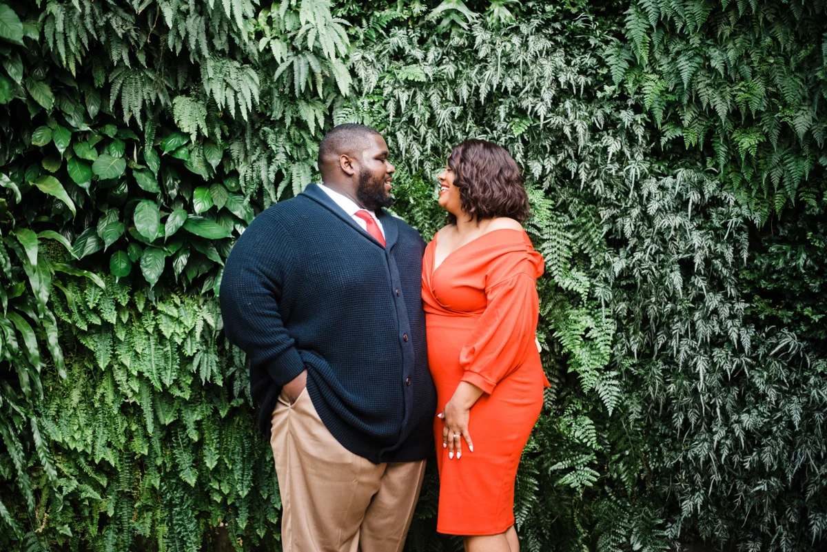 longwood gardens engagement kennett square pennsylvania sgw photography couple by foliage wall