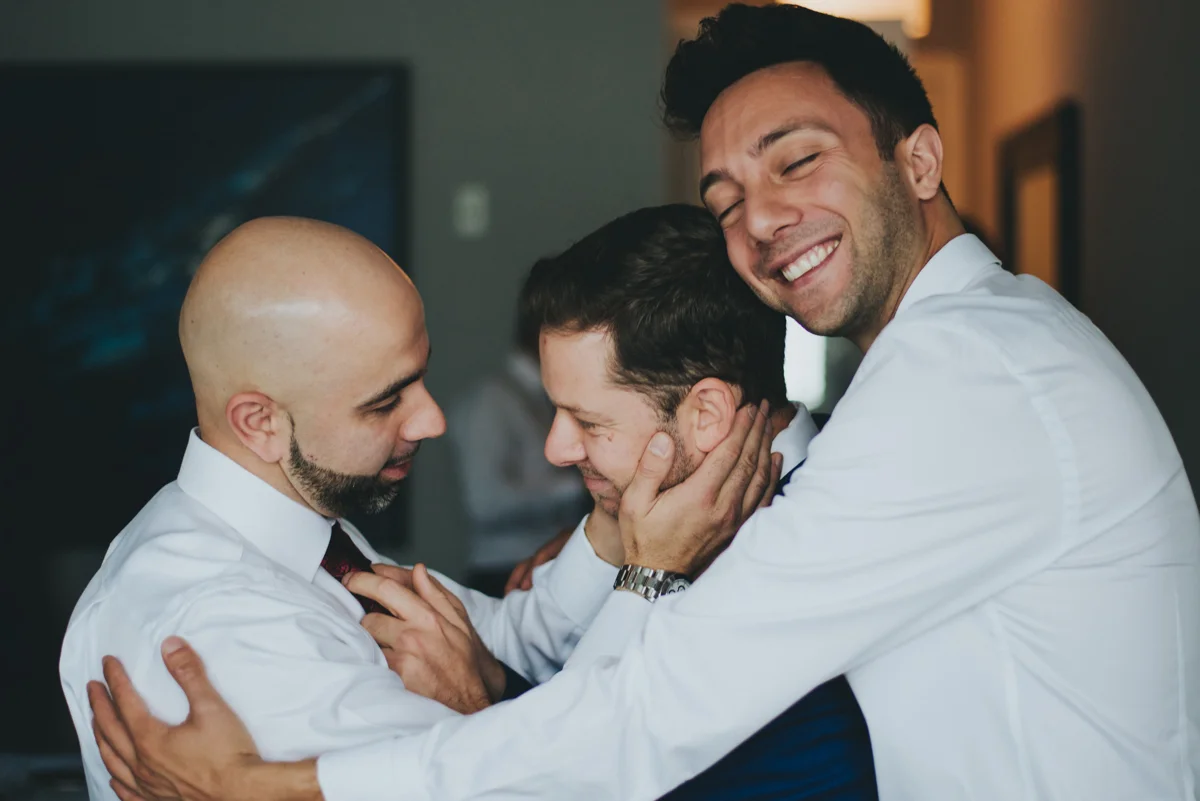 Persian-Canadian Wedding Innocent Thunder Photography Sooke Victoria Canada amin and groomsmen in group hug