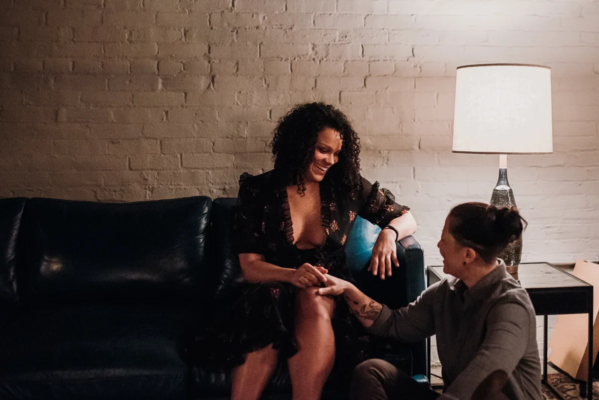 surprise proposal wm. mulherin’s sons hotel philadelphia pennsylvania lauren driscoll photography kimberly on couch, ashley on floor, couple holding hands