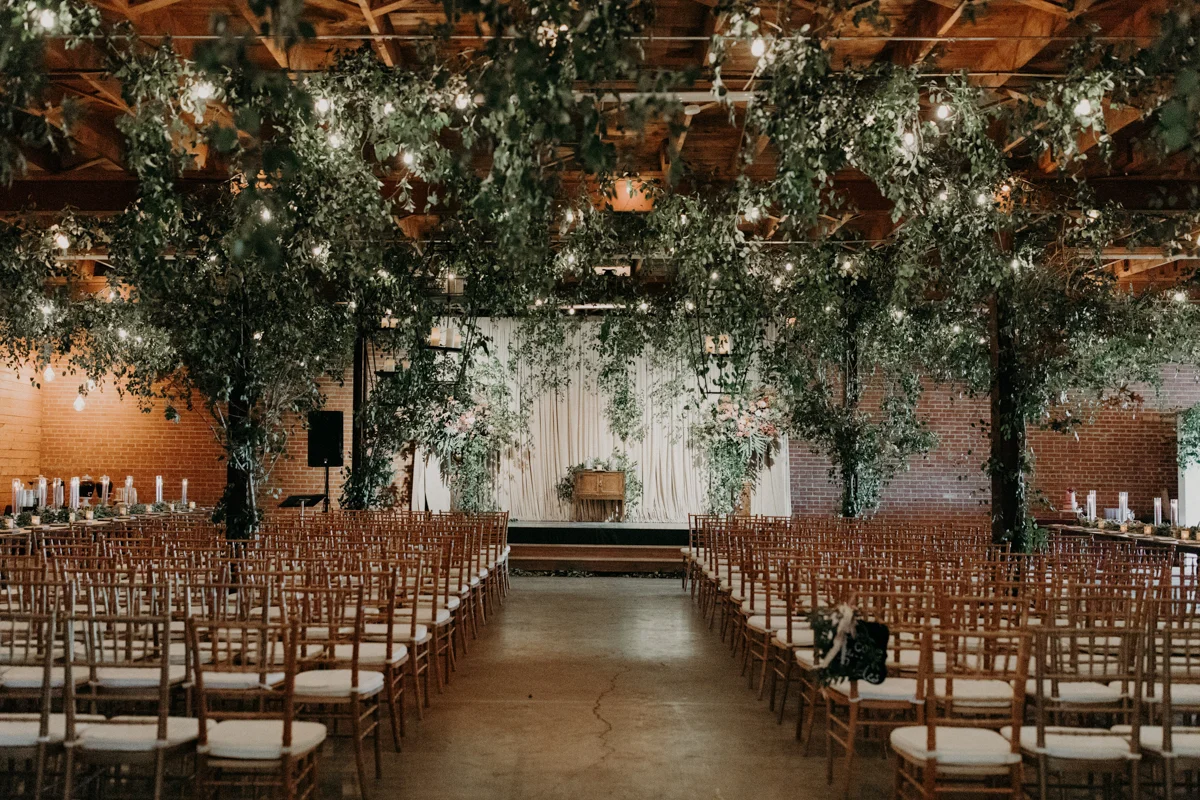 ABBY AND NICK WEDDING AMARILLO TX RITTER COLLECTIVE PHOTOGRAPHY GUEST SEATING AND ALTAR FROM BACK