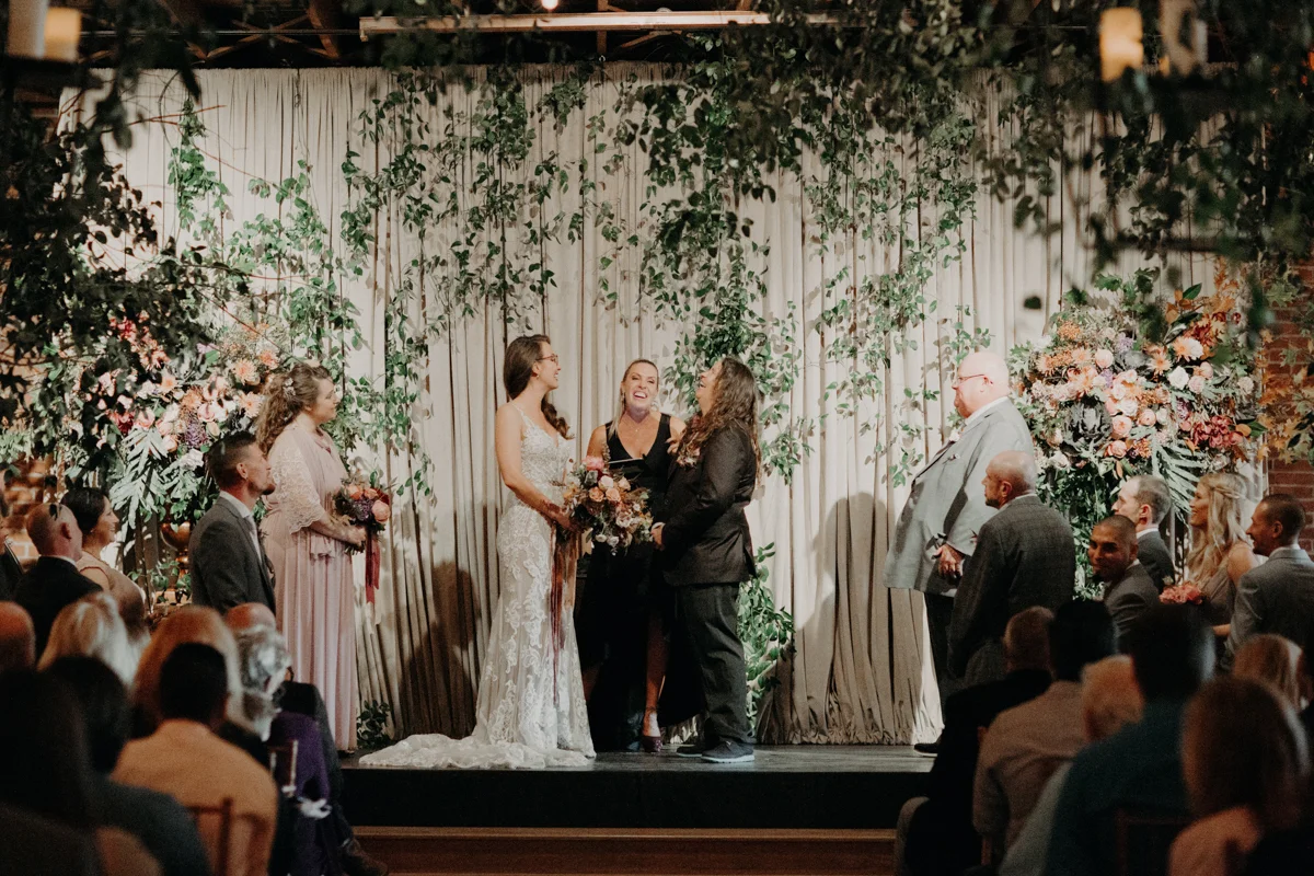 ABBY AND NICK WEDDING AMARILLO TX RITTER COLLECTIVE PHOTOGRAPHY COUPLE LAUGHING DURING CEREMONY