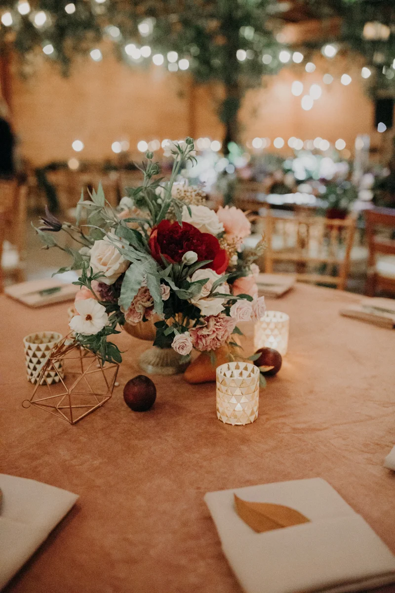 ABBY AND NICK WEDDING AMARILLO TX RITTER COLLECTIVE PHOTOGRAPHY TABLE WITH FLORAL, FRUIT, AND GEOMETRIC-SHAPE CENTERPIECES