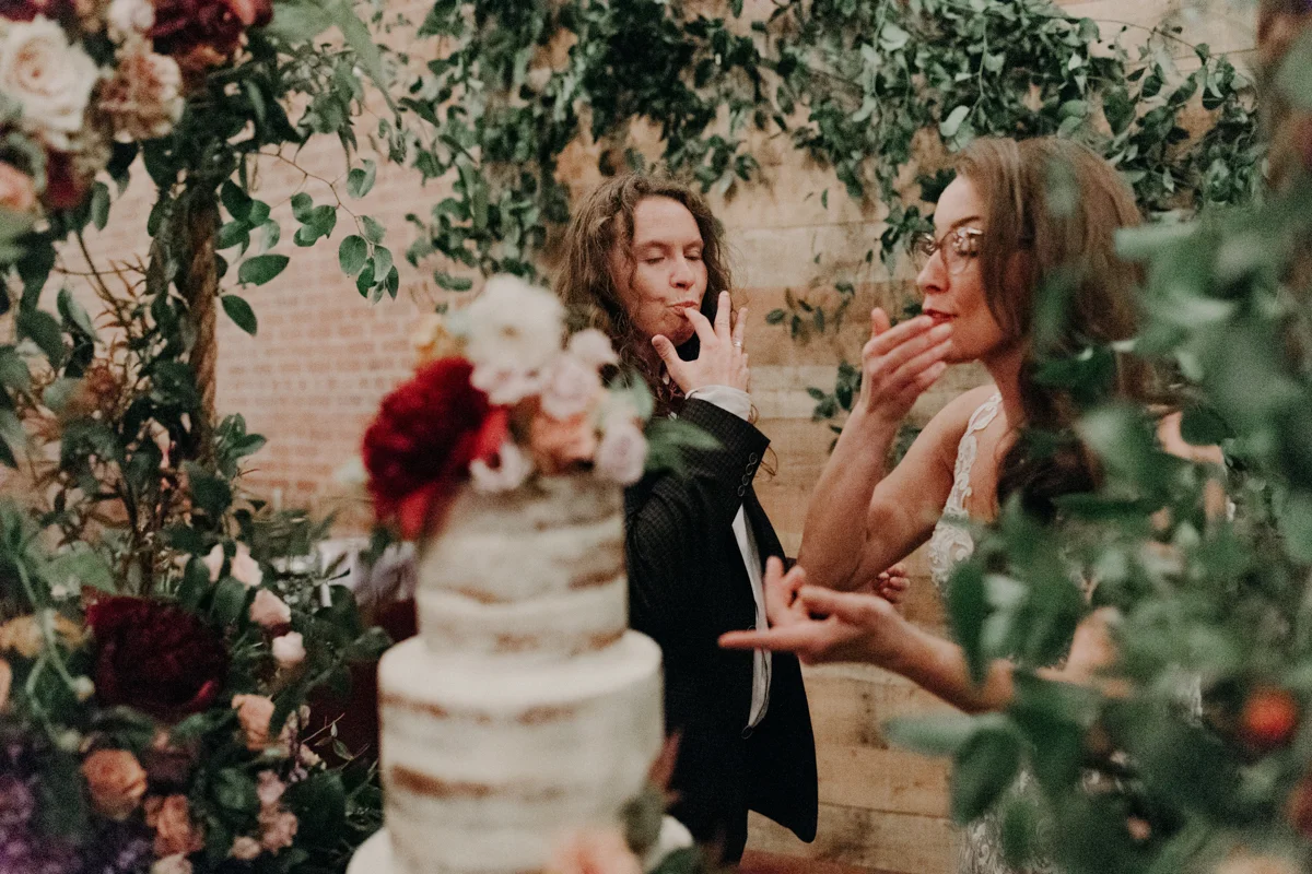 ABBY AND NICK WEDDING AMARILLO TX RITTER COLLECTIVE PHOTOGRAPHY COUPLE TAKING FIRST BITES OF CAKE