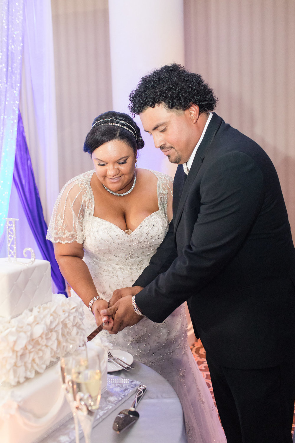bride and groom cutting cake at vintage DIY wedding in Tysons Corner Photography by Marirosa