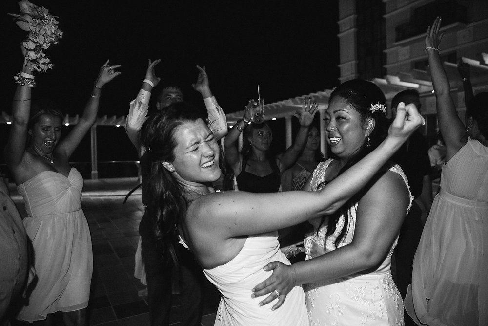 brides on the dance floor after jumping in pool at DIY Mexican destination wedding Leah Moyers Photography